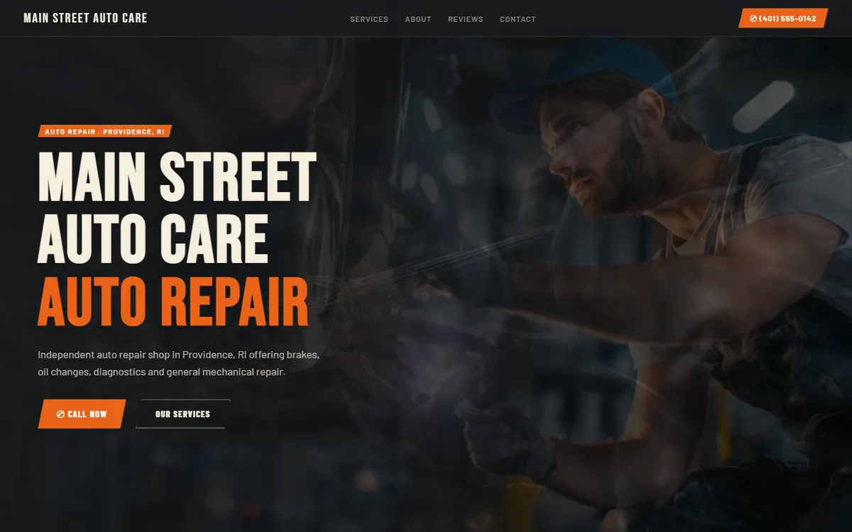 Desktop view of the Main Street Auto Care sample website, with a hero photo of a mechanic and a call-now button
