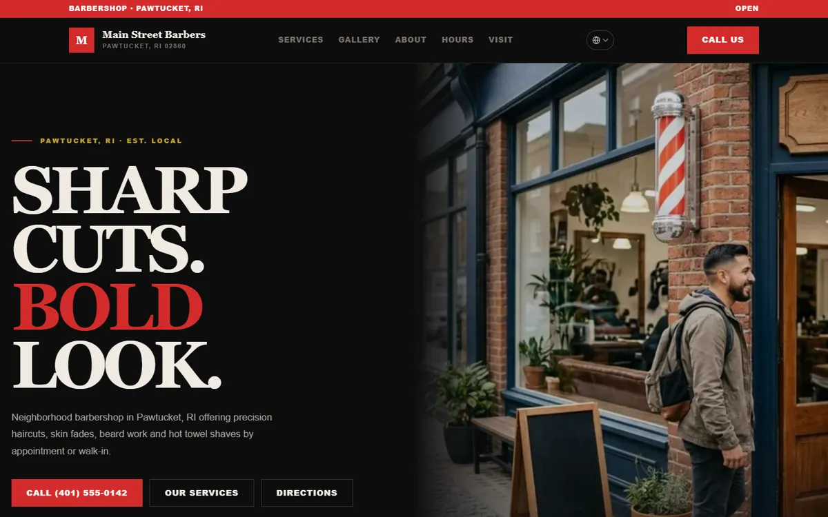 Desktop view of the Main Street Barbers sample website, with a storefront photo, a red barber pole and a call-now button