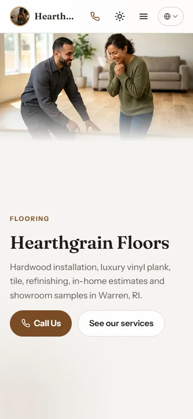 Mobile view of the Hearthgrain Floors sample website, with a homeowner and an installer looking at a floor